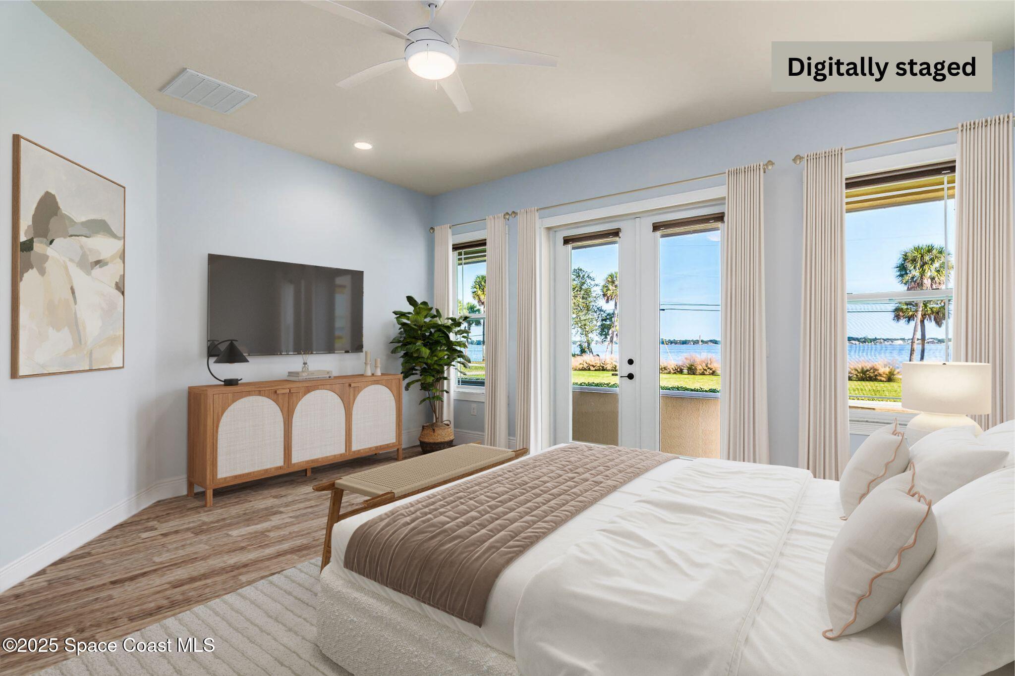 1953 Rockledge Drive Rockledge, FL 32955 - Photo 22 of 83 a bedroom with a large bed and a flat tv screen