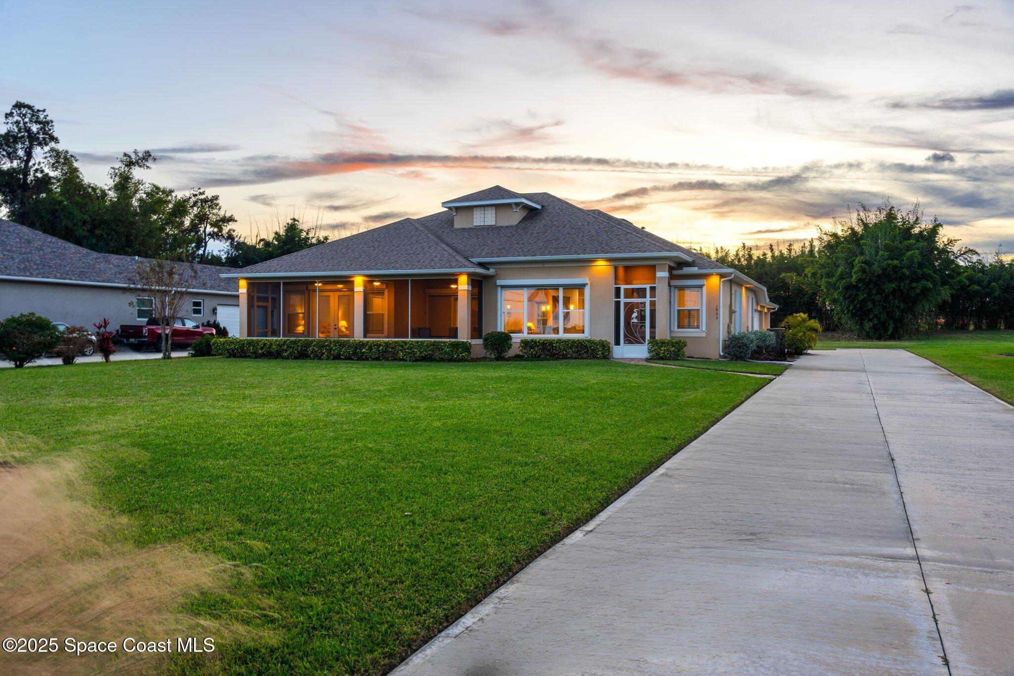 1953 Rockledge Drive Rockledge, FL 32955 - Photo 43 of 83 a view of a big house with a big yard and large trees