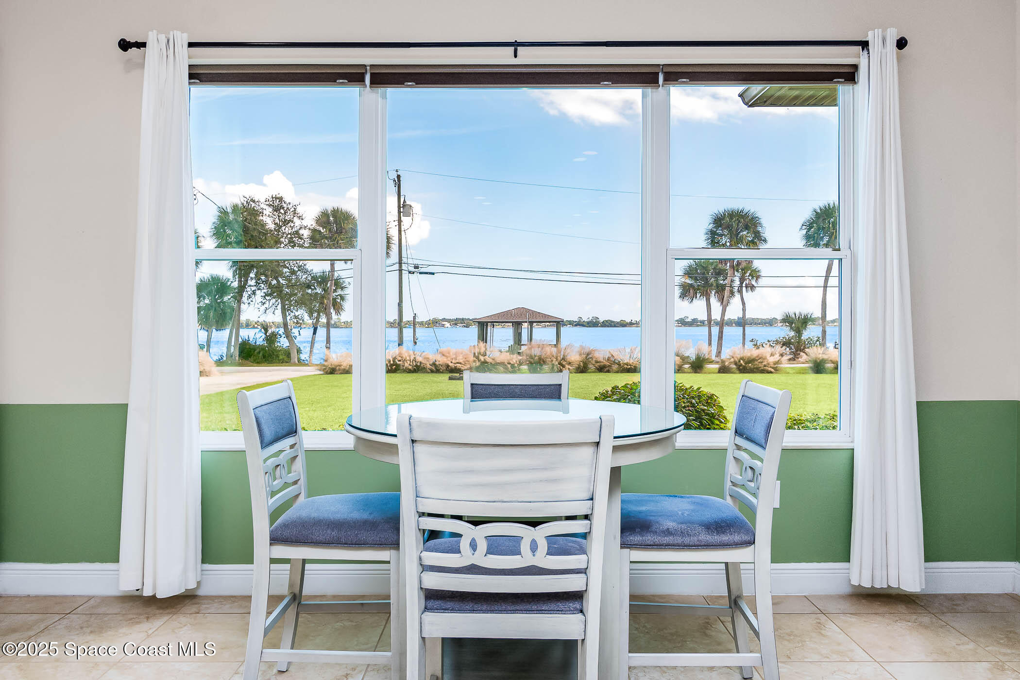 1953 Rockledge Drive Rockledge, FL 32955 - Photo 52 of 83 a dining room with a table and chairs