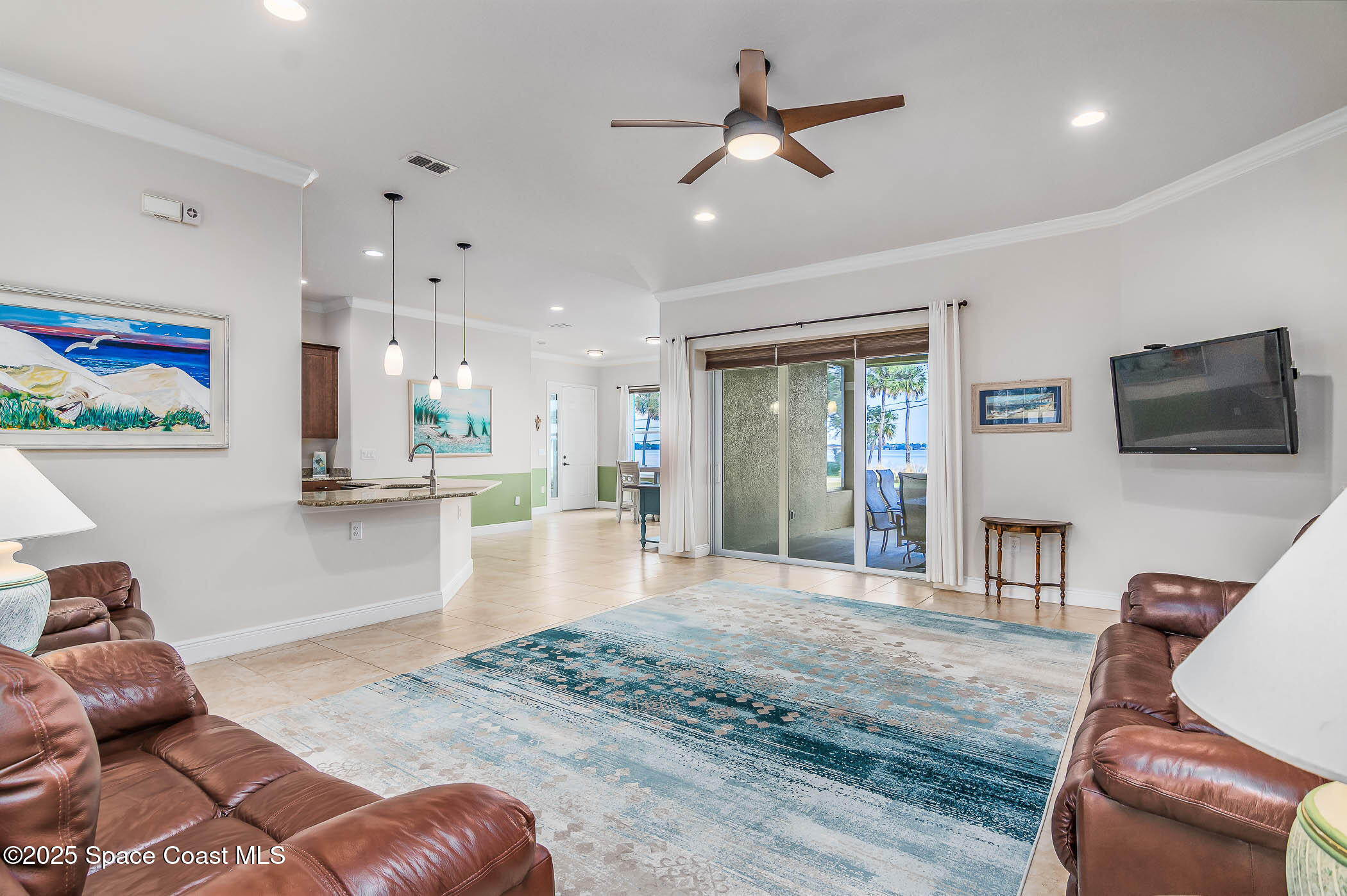 1953 Rockledge Drive Rockledge, FL 32955 - Photo 59 of 83 a living room with furniture and a flat screen tv