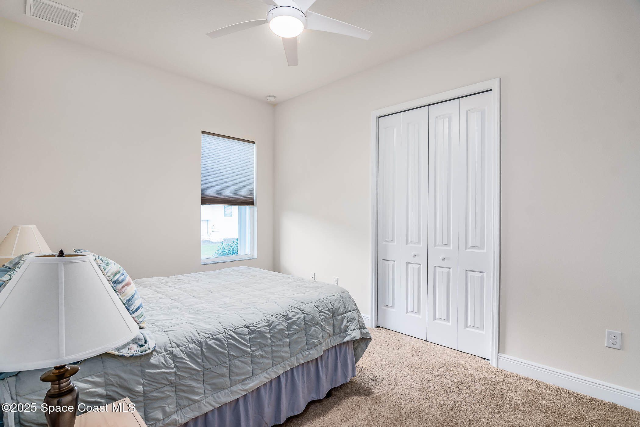 1953 Rockledge Drive Rockledge, FL 32955 - Photo 64 of 83 a bedroom with a bed and a window