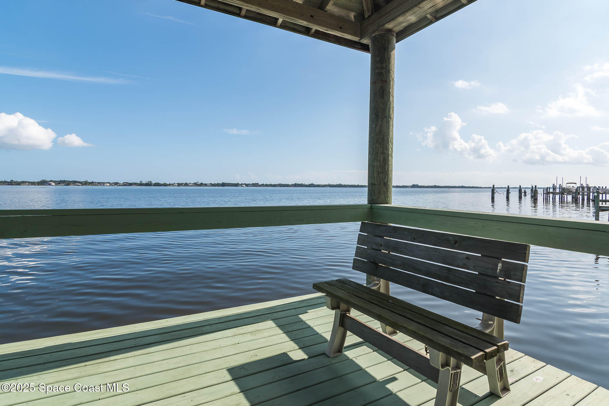 1953 Rockledge Drive Rockledge, FL 32955 - Photo 7 of 83 a wooden bench sitting on top of a wooden floor