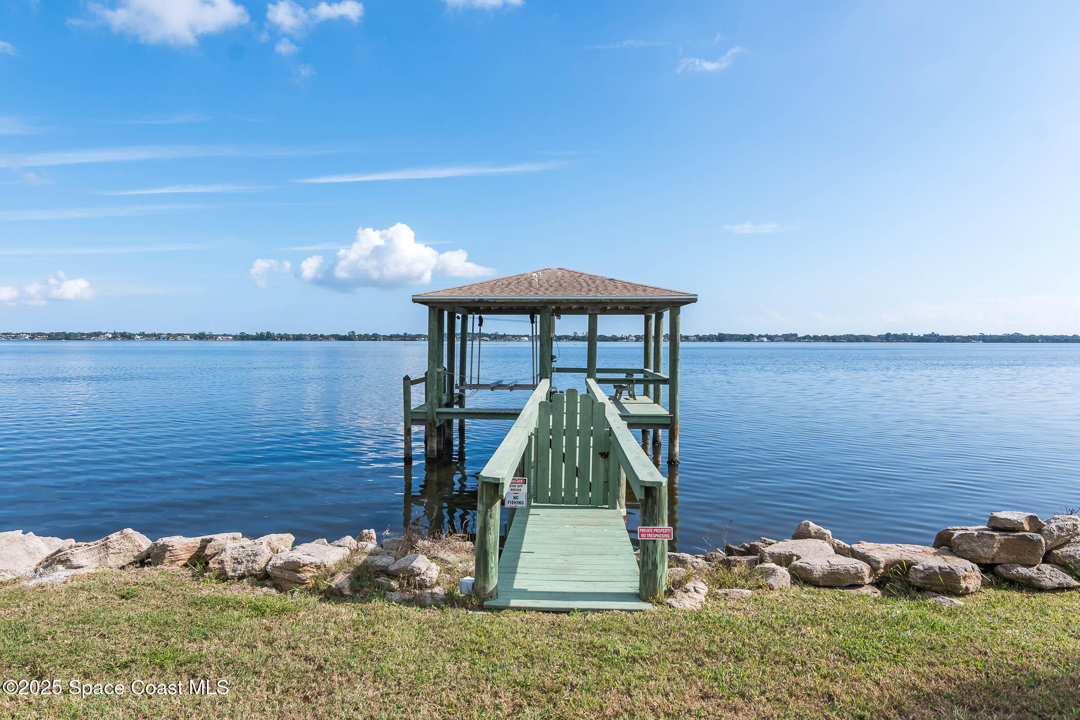 1953 Rockledge Drive Rockledge, FL 32955 - Photo 77 of 83 a view of a backyard with plants and lake view