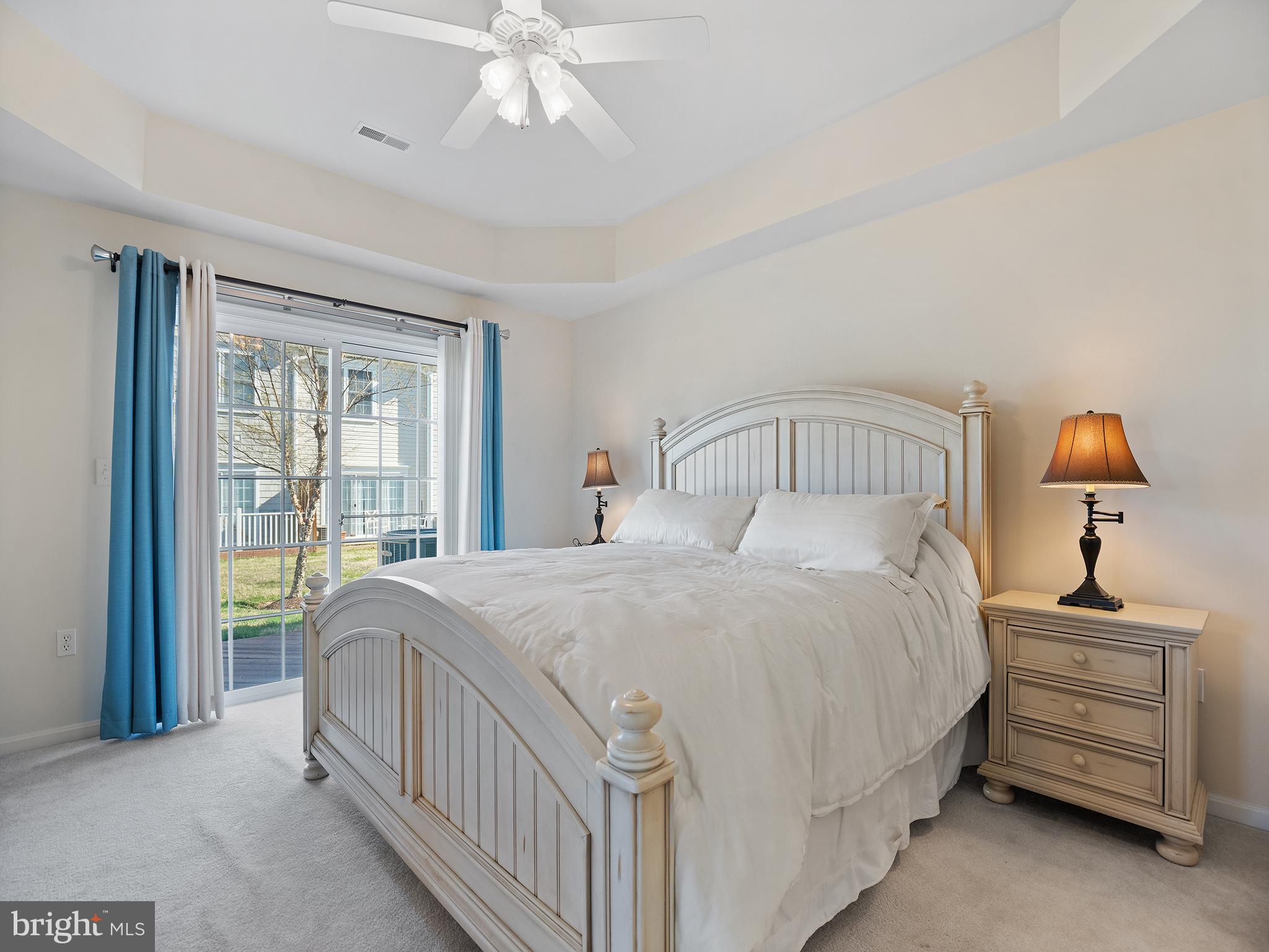 606 Ruxton Road, Unit 51 Dowell, MD 20629 - Photo 18 of 42 Primary BR with slider and tray ceiling