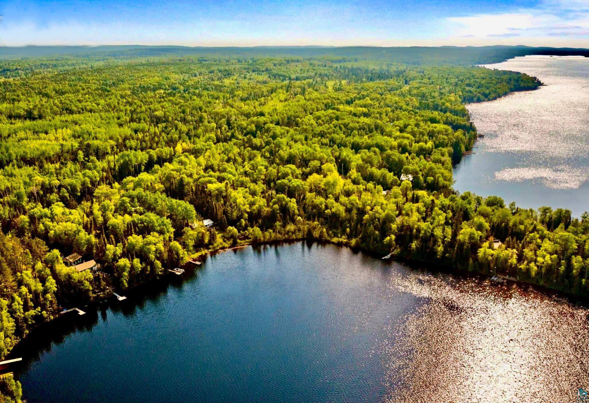 1480 Devil Track Road Grand Marais, MN 55604 - Photo 10 of 38 Drone / aerial view of a forest and a large body of water