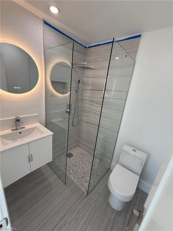 2823 Janet Street Matlacha, FL 33993 - Photo 13 of 16 a bathroom with a sink a toilet and shower