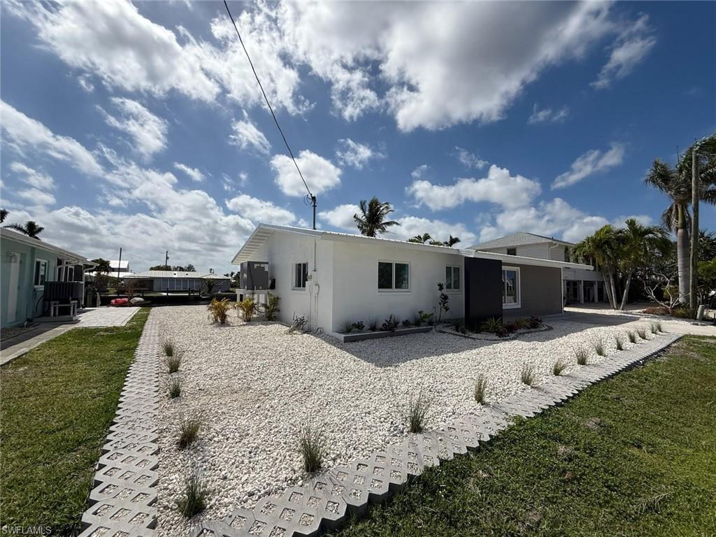 2823 Janet Street Matlacha, FL 33993 - Photo 14 of 16 a view of a backyard of the house
