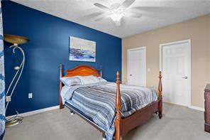 409 Stockton Ridge Cranberry Township, PA 16066 - Photo 12 of 19 a bedroom with a bed and lamp
