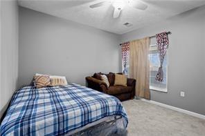 409 Stockton Ridge Cranberry Township, PA 16066 - Photo 13 of 19 a bedroom with a bed and wooden floor