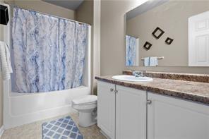 409 Stockton Ridge Cranberry Township, PA 16066 - Photo 14 of 19 a bathroom with a granite countertop sink a toilet and a mirror