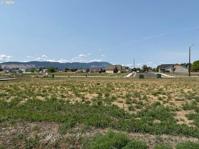 a view of a large yard with an outdoor seating