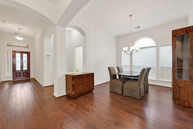 a view of a livingroom with furniture and wooden floor