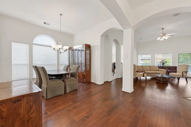 a view of a livingroom with furniture window and wooden floor