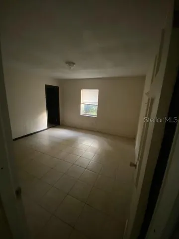 a view of empty room with windows