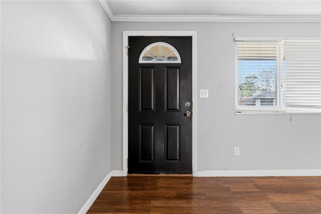 3890 Endover Road Dayton, OH 45439 - Photo 9 of 26 This inviting entry features durable wood flooring and a classic black door with an elegant arched transom.