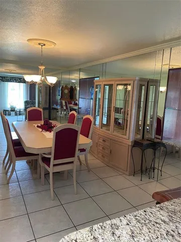 a bedroom with a bed and a mirror