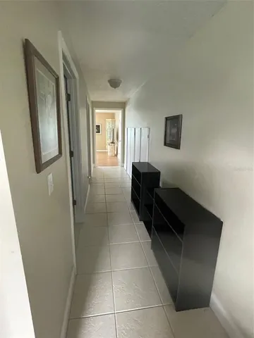 a kitchen with stainless steel appliances granite countertop a stove a refrigerator a sink a microwave oven with cabinets and wooden floor