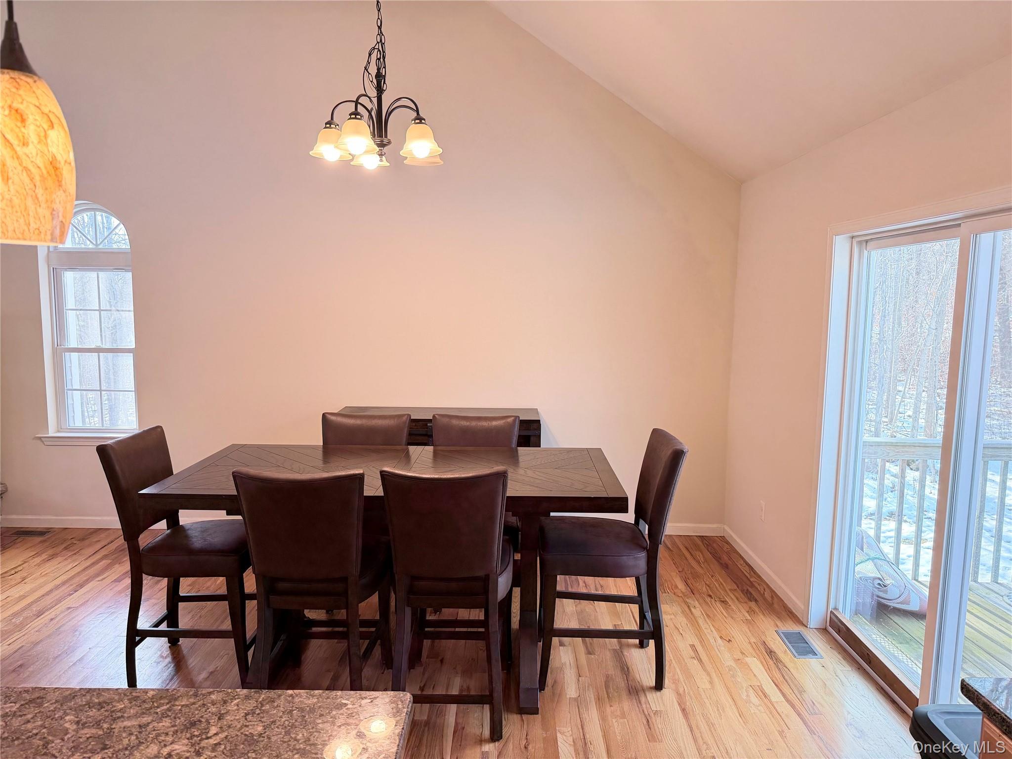 750 Mullock Road Port Jervis, NY 12771 - Photo 11 of 41 a view of a dining room with furniture and wooden floor