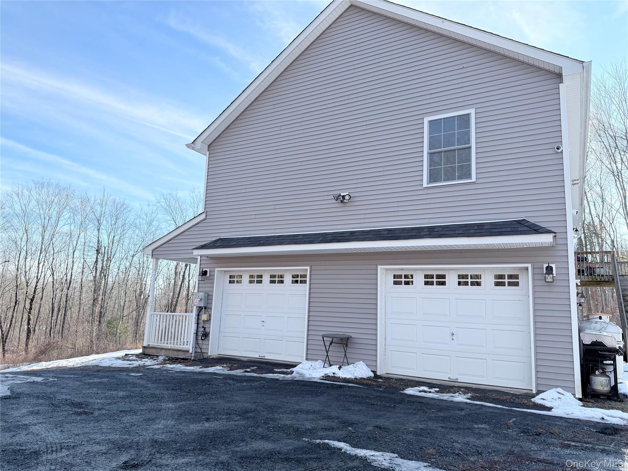 750 Mullock Road Port Jervis, NY 12771 - Photo 34 of 41 a front view of a house with a garage
