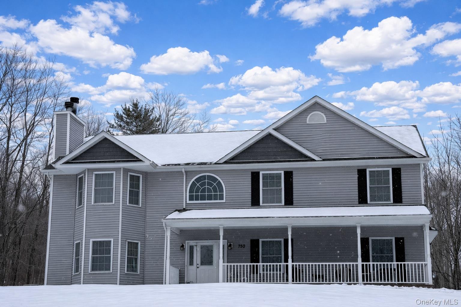 750 Mullock Road Port Jervis, NY 12771 - Photo 41 of 41 a white house with a large window and balcony