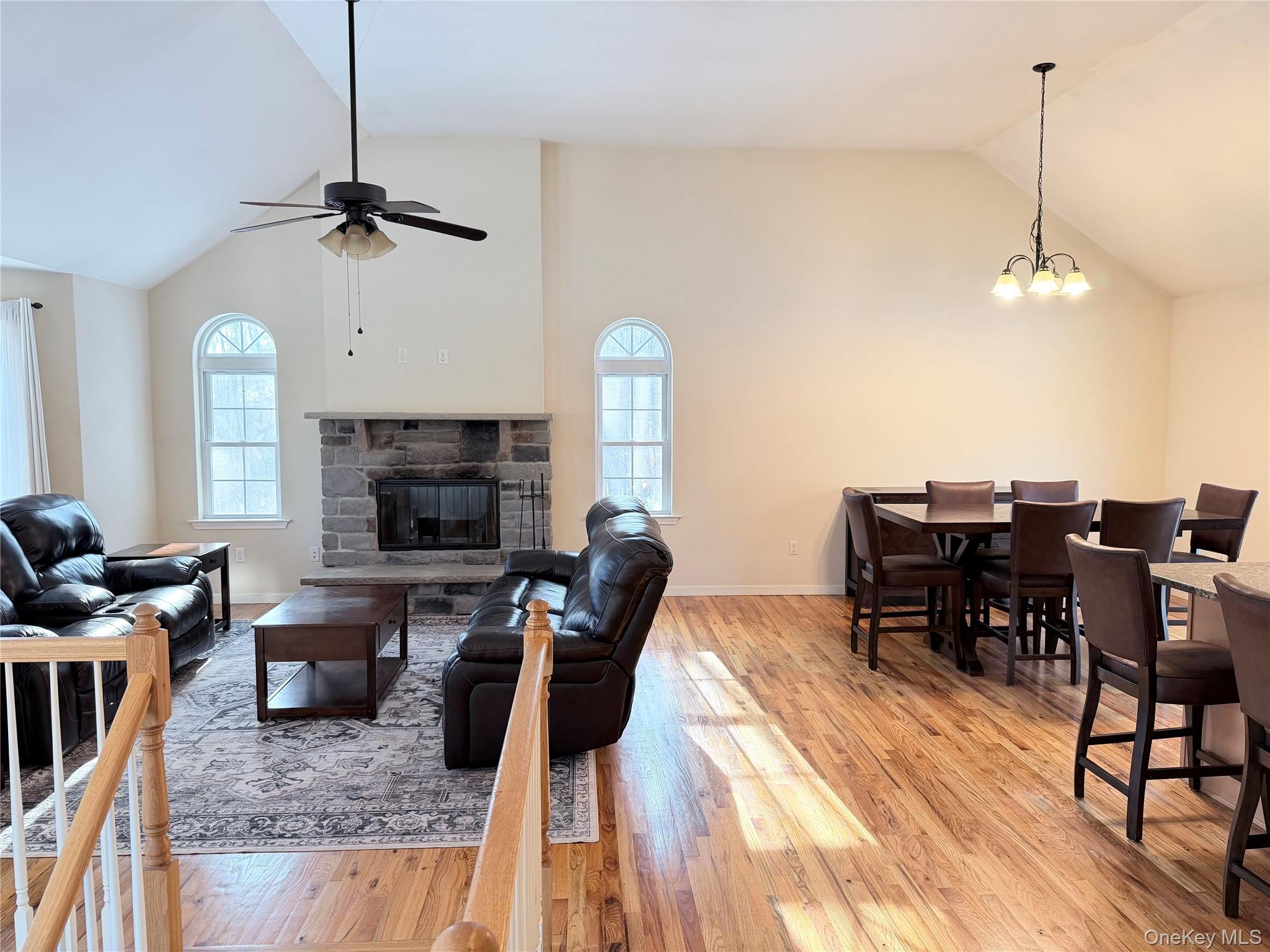 750 Mullock Road Port Jervis, NY 12771 - Photo 9 of 41 a living room with furniture a fireplace and a flat screen tv