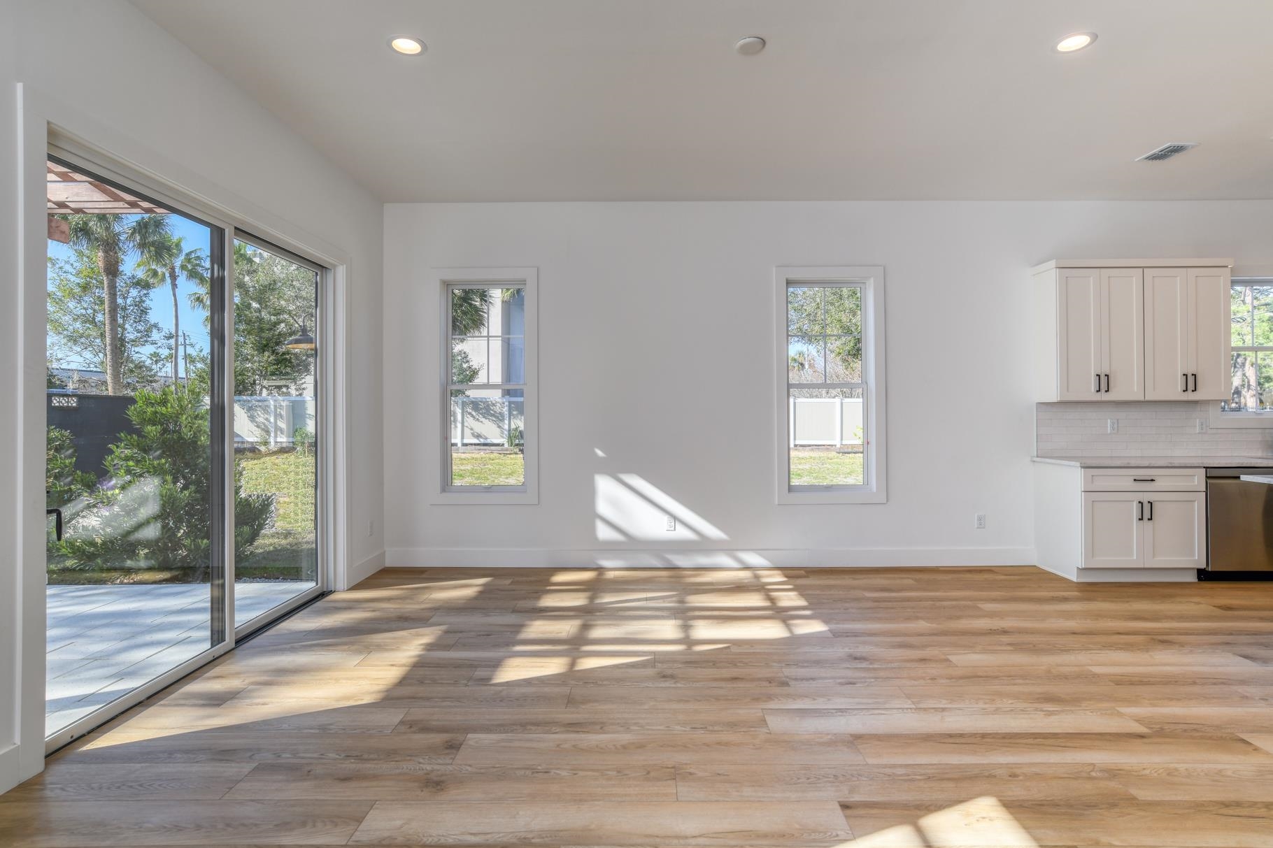 7 Sebastian Avenue, Unit D St. Augustine, FL 32084 - Photo 15 of 42 a bedroom with a bed and wooden floor