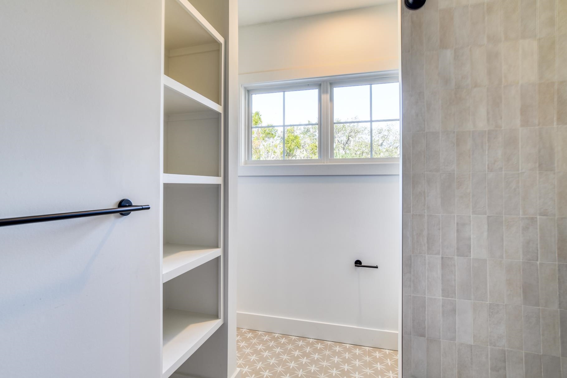 7 Sebastian Avenue, Unit D St. Augustine, FL 32084 - Photo 29 of 42 a bathroom with a window
