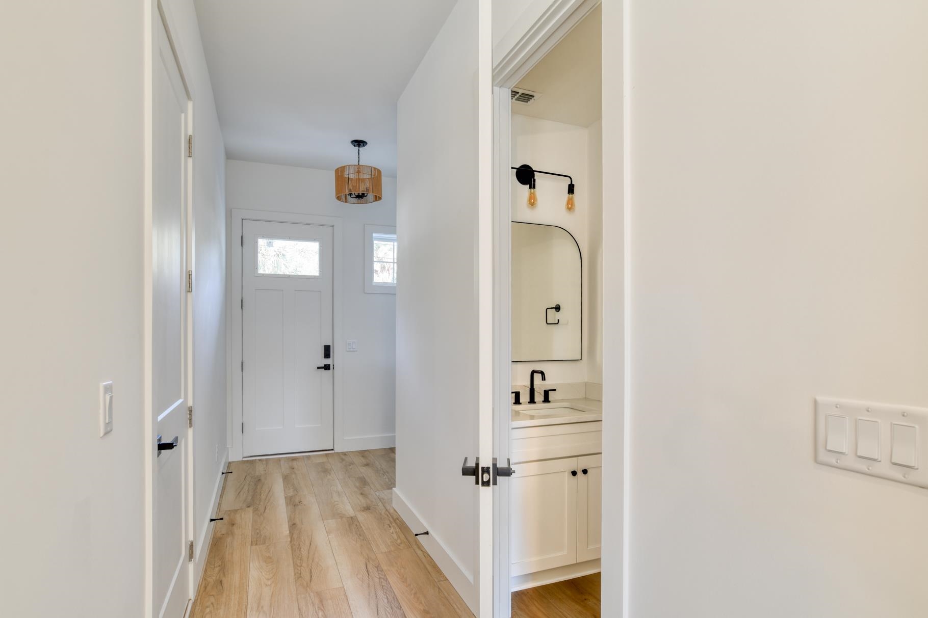 7 Sebastian Avenue, Unit D St. Augustine, FL 32084 - Photo 5 of 42 a view of a hallway with wooden floor and closet