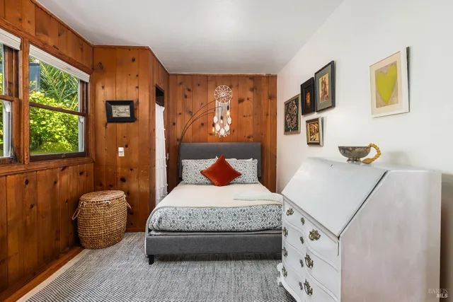 a bedroom with furniture and window