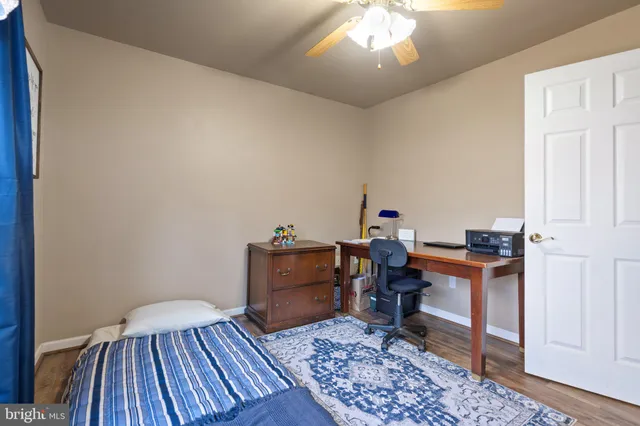 a bedroom with a bed and a mirror