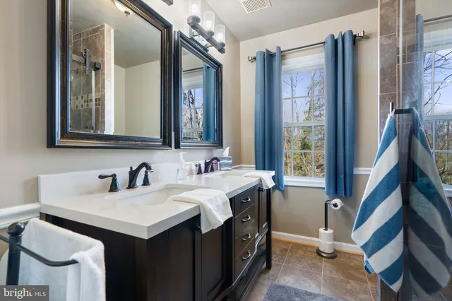 a living room with furniture a wooden floor and a piano
