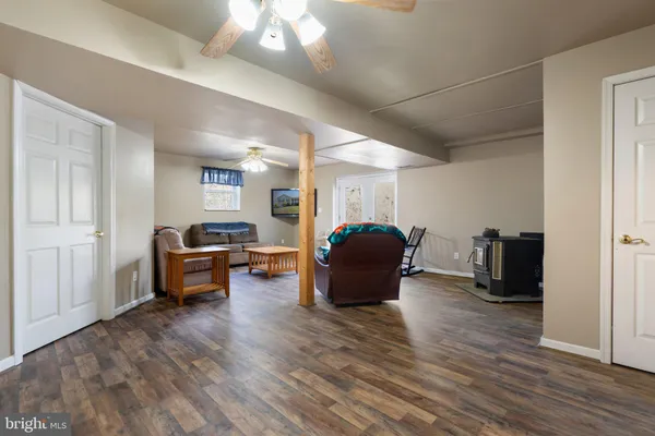 a bed sitting in a bedroom next to a chandelier