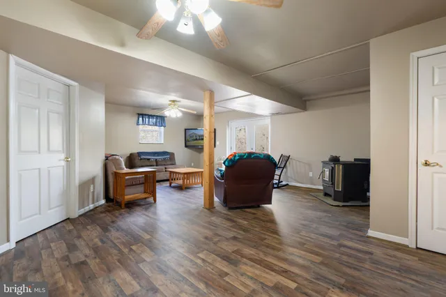 a bed sitting in a bedroom next to a chandelier