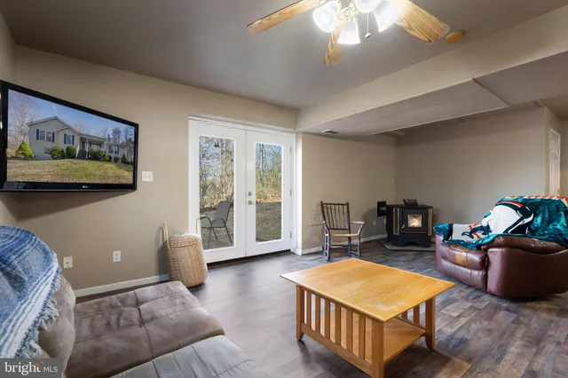 a kitchen with stainless steel appliances granite countertop a stove cabinets and wooden floor