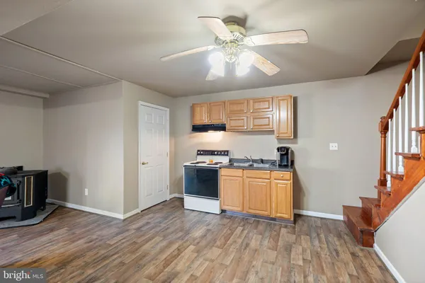a view of a house with swimming pool and sitting area