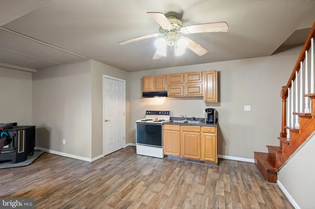 a view of a house with swimming pool and sitting area