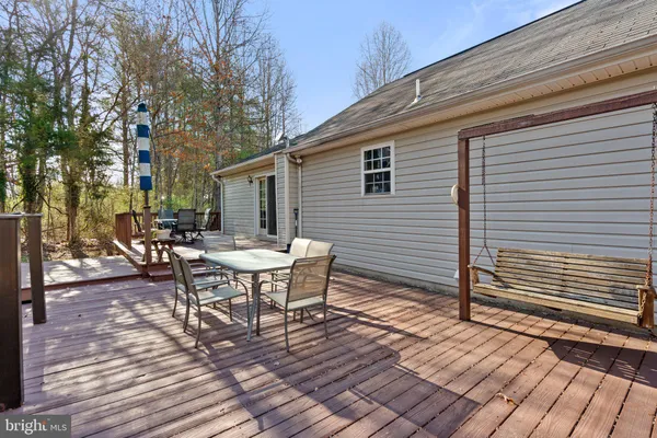 a view of a patio with a table and chairs