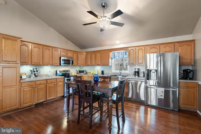 a view of a dining room with furniture and wooden floor