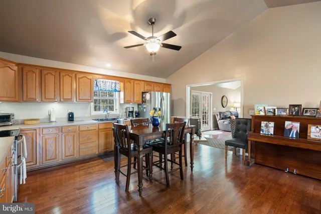 a view of a dining area with furniture window and wooden floor