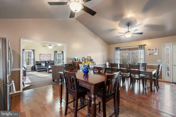 a kitchen with stainless steel appliances granite countertop a stove a sink a microwave a refrigerator and cabinets