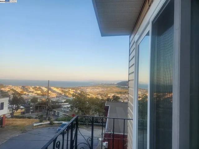 a view of a balcony with an ocean view