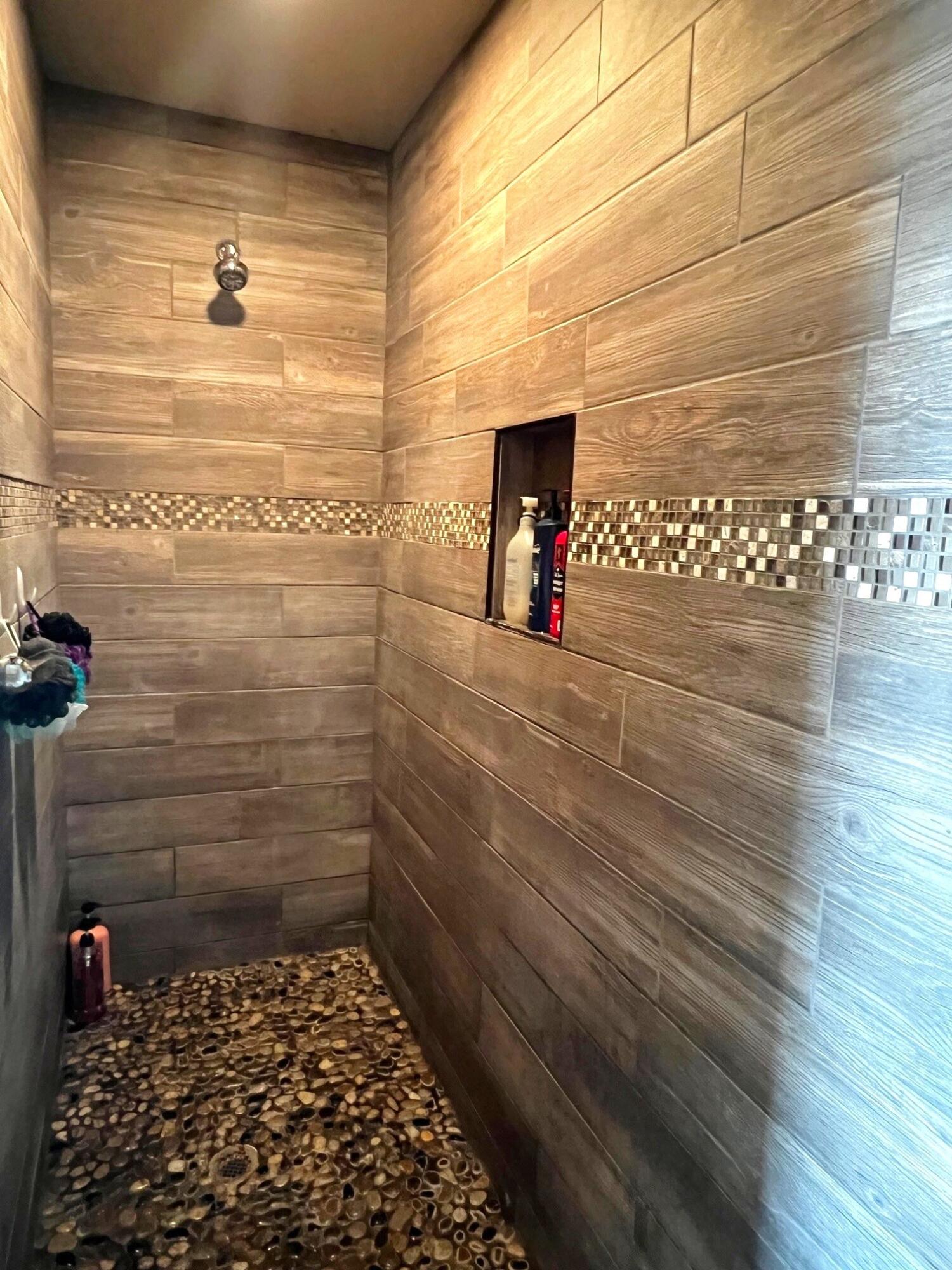 8803 10th Place Lubbock, TX 79416 - Photo 18 of 27 a bathroom with a shower