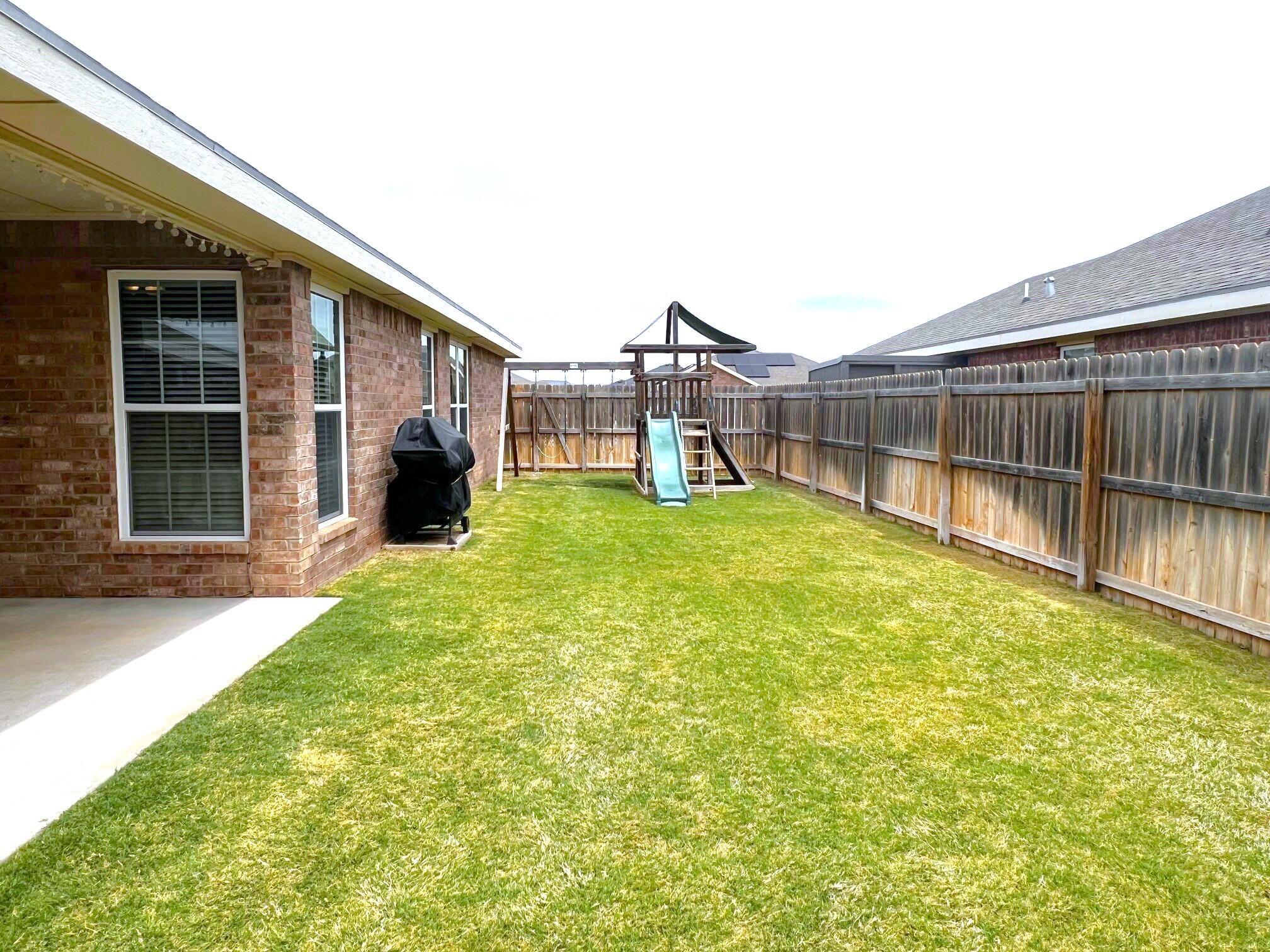 8803 10th Place Lubbock, TX 79416 - Photo 25 of 27 a view of a house with a yard and sitting area