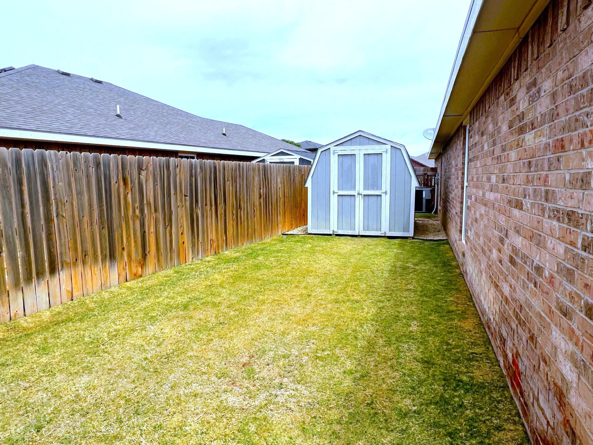 8803 10th Place Lubbock, TX 79416 - Photo 26 of 27 a view of a back yard of the house