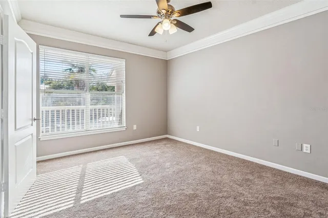 an aerial view of a house with a garden and lake view