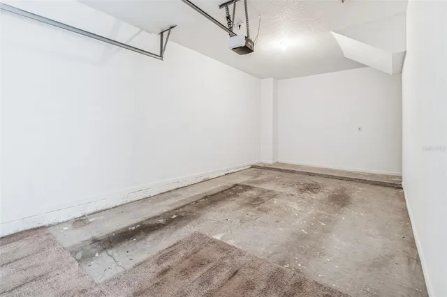 an aerial view of a house with outdoor space