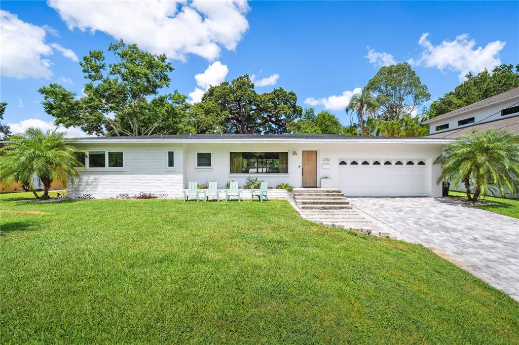 2102 Ivanhoe Road Orlando, FL 32804 - Photo 1 of 1 a view of a house with backyard and sitting area