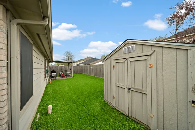 a view of a front door and yard
