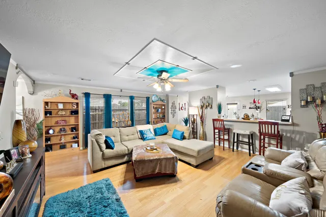 a living room with furniture and a large window