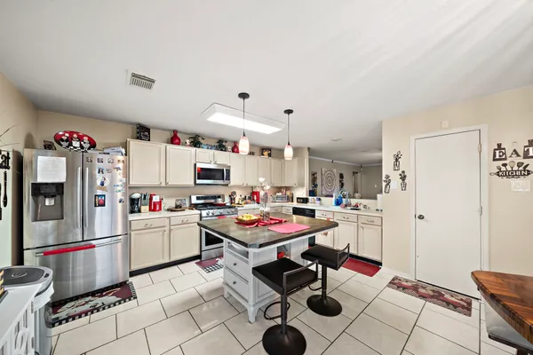 a room with furniture and a flat screen tv